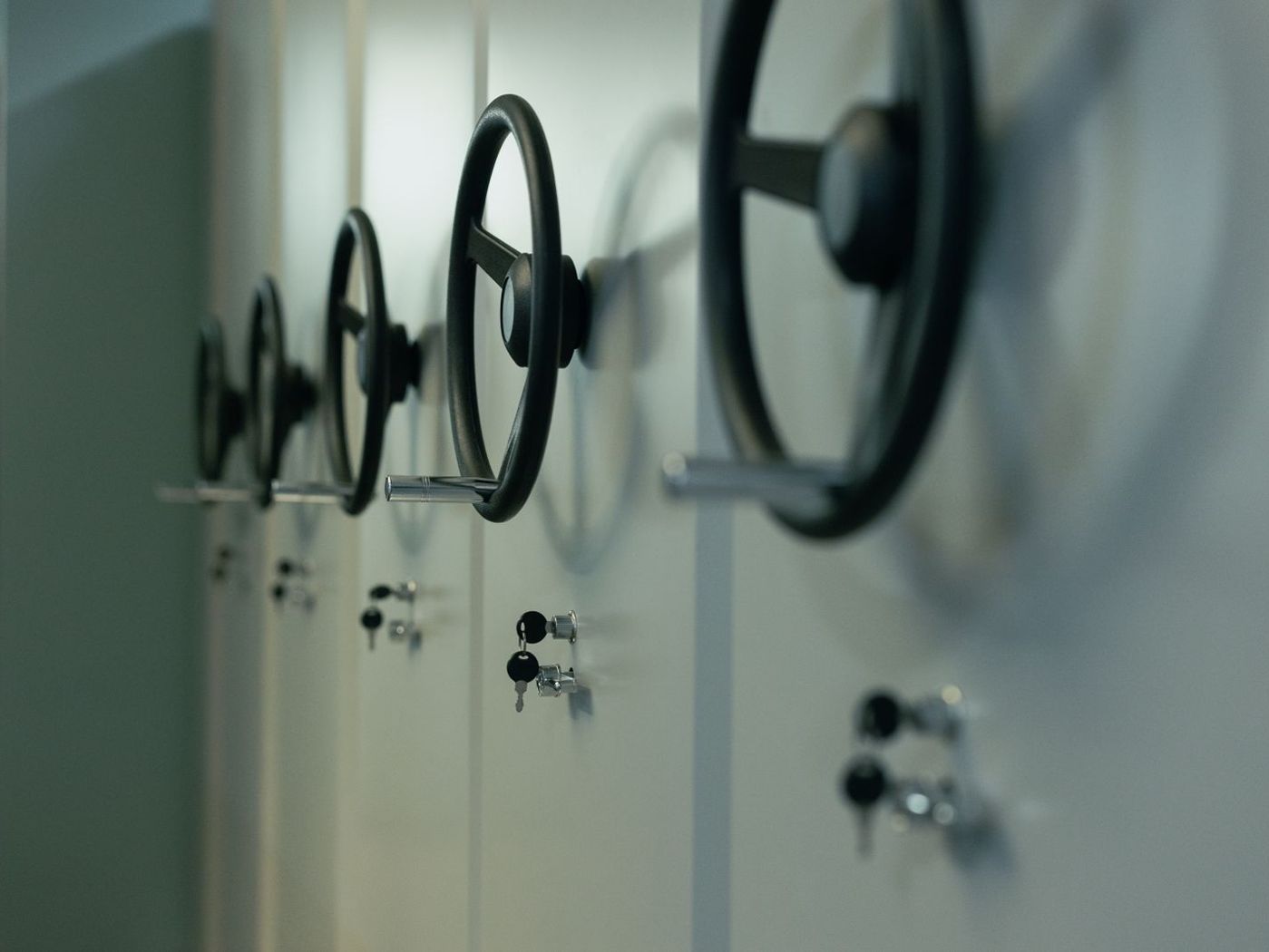 A row of steel safes with combination wheels